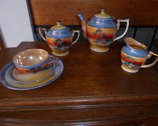 Vintage Japanese TT Lusterware Tea Service 
Complete tea set for two: Teapot/ Creamer/ Sugar Bowl/ Cups/ Saucers/ Dessert Plates 
Extra pieces: 
Dessert Plates (1) 
Saucers (5) 
