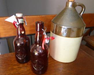Vintage Grolsch Lager Amber Embossed Bottles
Set of 2 w/porcelain swing top stoppers; 9.5” H
Antique Two-toned Moonshine Jug 
Brown & cream stoneware w/cork; 12” H
