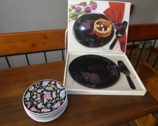 Mikasa Cake Plate w/Server
Black Tango  fine bone china w/matching server in original box; 12” diameter                                                                        Vintage Jingdezhen Zhongguo Famille Rose Noire Mille Fleur Dessert/Side Plates 
Porcelain; set of 8 plates; 7” diameter
Stamped: Made in China 09

