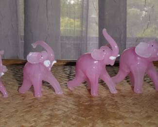Vintage Pink Glass Elephant Figurines
Family of four; semi-translucent pink color
Height (tallest to shortest): 3”; 2.75”; 2.25”; 1.75”
