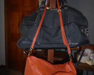 Vegan Leather Shoulder Bag
Zipper closure; inner pockets (2) & zipper compartment; adjustable strap for shoulder/cross-body wear                                                                                       Weekender Tote 
Black fabric; three compartments; handles & shoulder strap 

