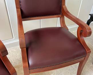 Pair of Heavy Carved arm chairs w leather seats..