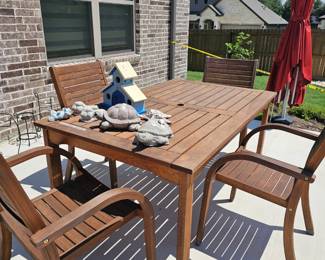 wooden table and 4 chairs, great outdoor seating, umbrella is not for sale. 