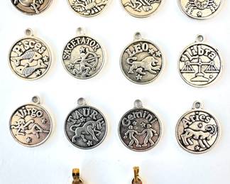 Zodiac Charms: H. Stern Enamel Cancer & Taurus Pendants (6 Grams) & Full Set 12 Zodiac Charms (18.4 Grams)
Lot #: 157