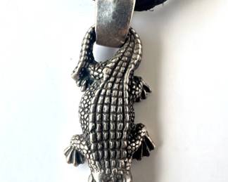 Bill Wall Sterling Silver Musician's Necklace With Alligator Slider On Leather Cord (60 Grams)
Lot #: 78