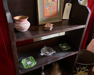 Wooden shelf with assortment of items