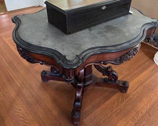 Gray slate-top turtle table and Austrian music box