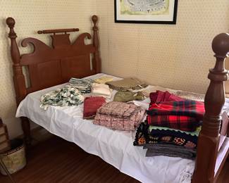 Antique twin bed and various linens