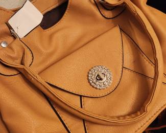 There are many, many woman's purses and bags.