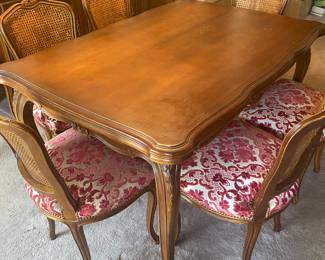 Dining table 57”x40”. Extends 19” on both sides for total of 95”. 6 matching chairs