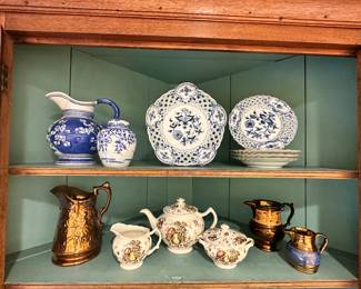 The Top Shelf Features Two's Company Water Pitcher Alongside an Antique Meissen Plate Collection and Below we have Johnson Brothers "Autumn's Delight" Teapot and Creamer Shown with A Collection of Copper Lustreware.