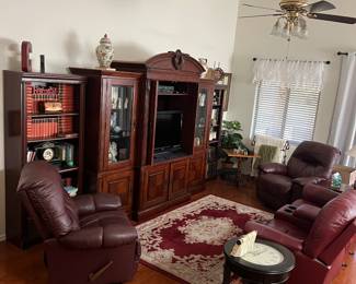 BOOKCASES (NOT ATTACHED TO WALL UNIT) BROYHILL WALL UNIT, FLAT SCREEN TV, VINTAGE BOOKS, LEATHER RECLINERS, DOUBLE LEATHER THEATER SEATING, AREA RUG, CLOCK TABLE, DECOR