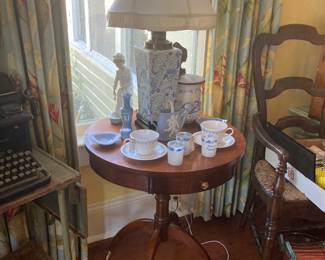 Mid century side table filled with blue & white items