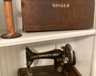 Antique Singer sewing machine with original wooden cover