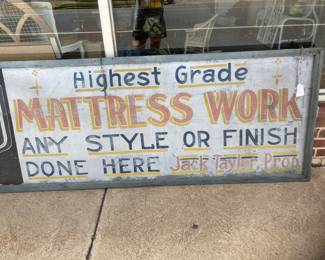 Vintage doubles-sided metal advertising sign encased in wood