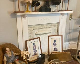 Antique wicker rocker, dolls and hats and vintage hat stands. Vintage shelves and prints