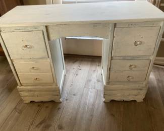 Shabby chic painted with glass knobs.
