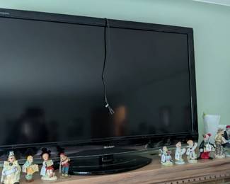 52" Sharp Aquos television with remote.