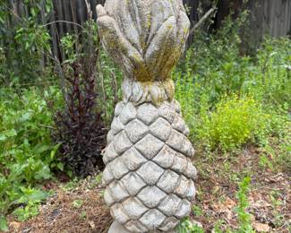 Tiki time. Whimsical pineapple concrete yard statue.