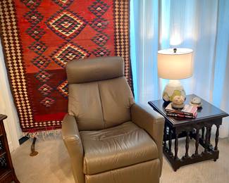 Kilim rug 9.5 ft by 4.25 ft.
IMG Leather swivel rocker/recliner from Norway.