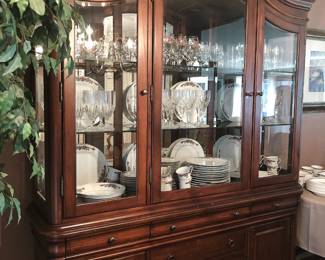 Gorgeous French style china cabinet with interior lighting, glazed doors, and multiple drawers