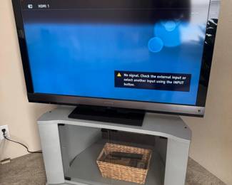 25 SonyBravia46LCDTVSwivelingGlassDoorTVStandBasket