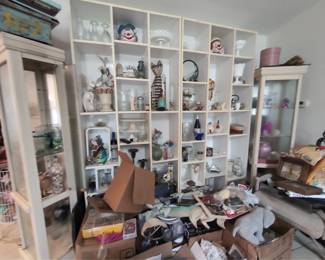 Dining area. Barometers, antique clock, display glass, etc