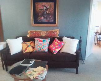 Couch, pillows, bath scales, small tables, and more