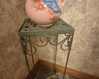 Green stand with cute flower pot