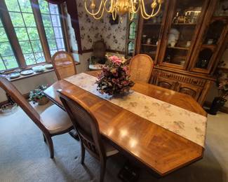 Beauful dining room with four chairs. Comes with two leaves.