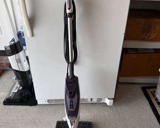 Shark stick vacuum cleaner.