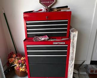Red Craftsman tool chest with "Land of Liberty" sign.