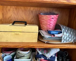 Storage organizers - Yellow metal box, pink basket, and woven container with magazines