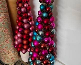 Colorful Christmas ornament garlands.