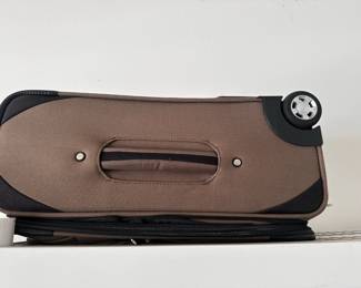 Brown rolling luggage suitcase.