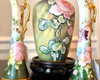 ($50 each-2 available; hand painted porcelain rose pitcher with gold handle; 7"h) ($68; Nippon hand-adorned vase on stand; 9"h)