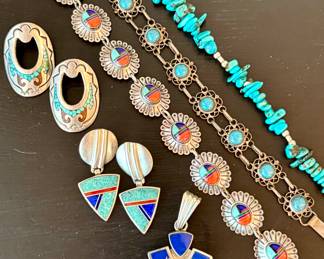 ($60; oval sterling silver and turquoise pierced earrings) ($60; sterling silver and turquoise pierced earrings with drop triangular shape) ($200; sterling silver, turquoise and stone pendant) ($90; sterling silver and turquoise and stone bracelet) ($68; sterling silver and turquoise intricately linked bracelet) ($68; turquoise and sterling silver necklace)
