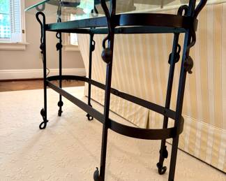 $350 - contemporary wrought iron table base, glass top table, leaf accents on legs; (48x18x27)