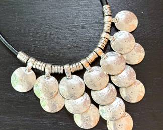 $40; sterling silver and leather necklace