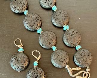 $80; lava rocks and sterling silver pierced earrings and coordinating necklace with serpent clasp