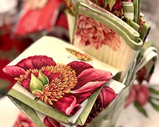 $44; set of 7 placemats and 8 napkins with red botanicals and green trim