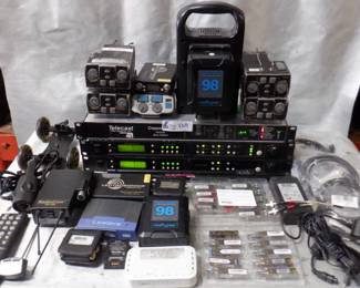 BOX ELECTRONICS INCLUDING WIRELESS MIC BELT PACKS, RADIO COM TR-825, LECTROSONIC UCR-411A, RADIO COM BTR-800, RADIO COM TR-700, LINKSYS SWITCH, INDI PRO PD-2KS BATTERY CHARGER, AND MORE