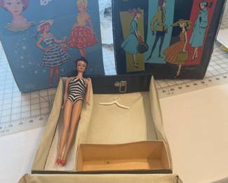 Original 60s ponytail Barbie with case, and two additional vintage Barbie cases.