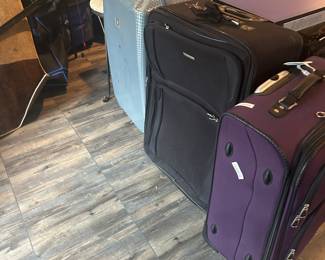 Rolling suitcases.