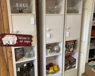 3 tall white cupboards