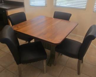 Chelsea Kitchen table 41 & 1/2 x 41 & 1/2 also has 2 leaves to extend and 4 grey kitchen chairs with base that is sage green. Great condition!