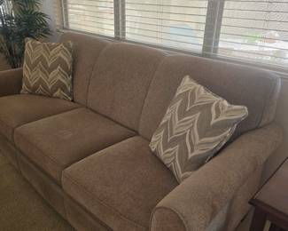 New tan Hide-a-bed with comfy memory foam mattress. This is in excellent condition!
