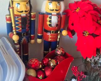 2 large nutcrackers, sleigh, 2 poinsetta plants
