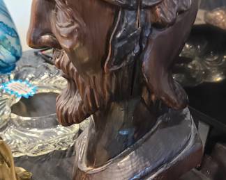 Wooden bust antique, side view.