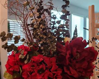 Beautiful flower arrangement in red vase.